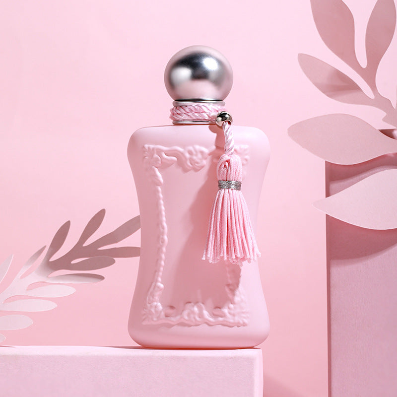 Pink Velvet Luxury Perfume bottle with elegant design against a soft pink background.
